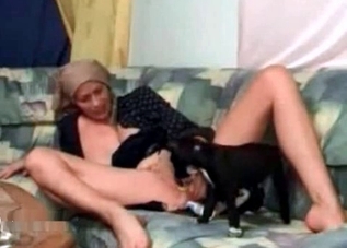 Dirty model is making a puppy give her a cunnilingus