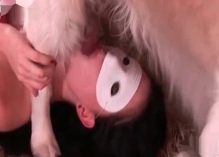 Dark-haired slut wearing a mask is eating her pet's cum